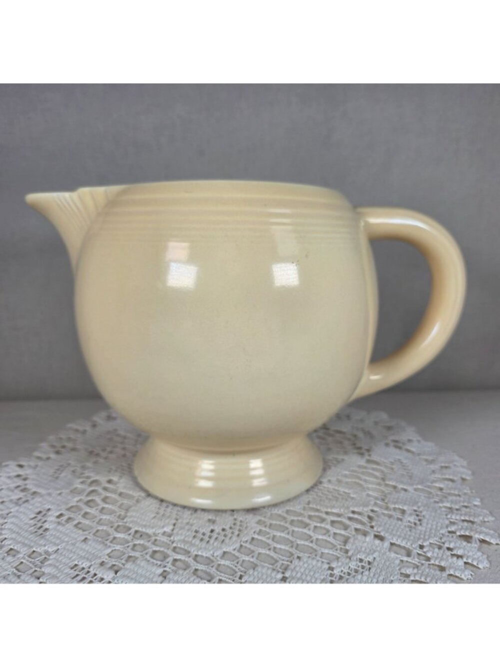 Vintage Fiesta Ivory Ice Lip Pitcher 9 1/2" Wide 7" Tall With Minor Chips On Bas - Picture 3 of 8